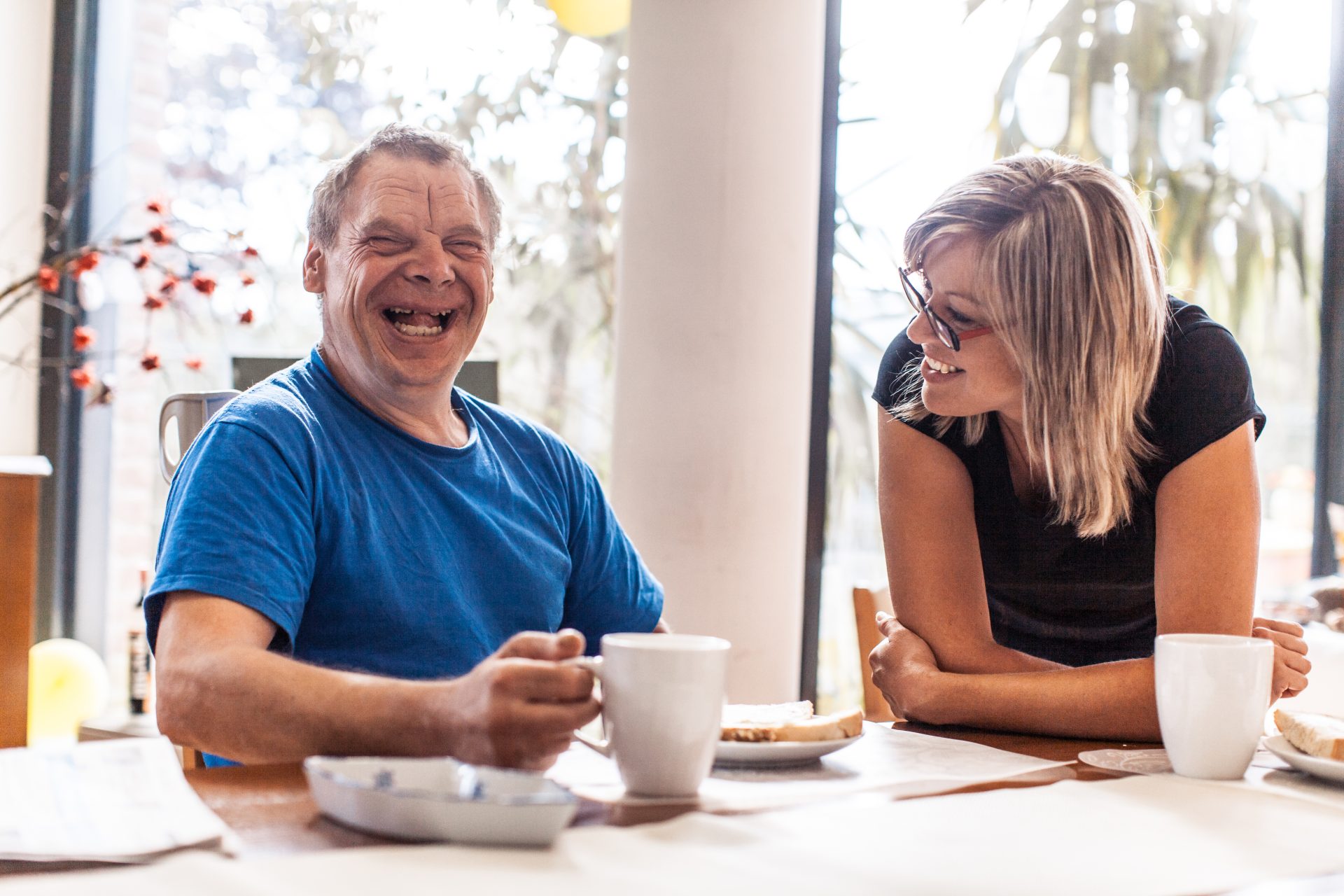 Adult Man Portrait with a Down Syndrome in a Daycare Center