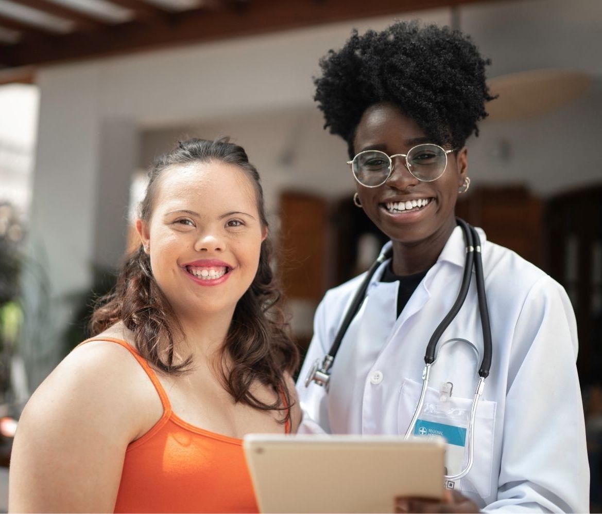 Smiling Nurse and Adult with IDD Patient